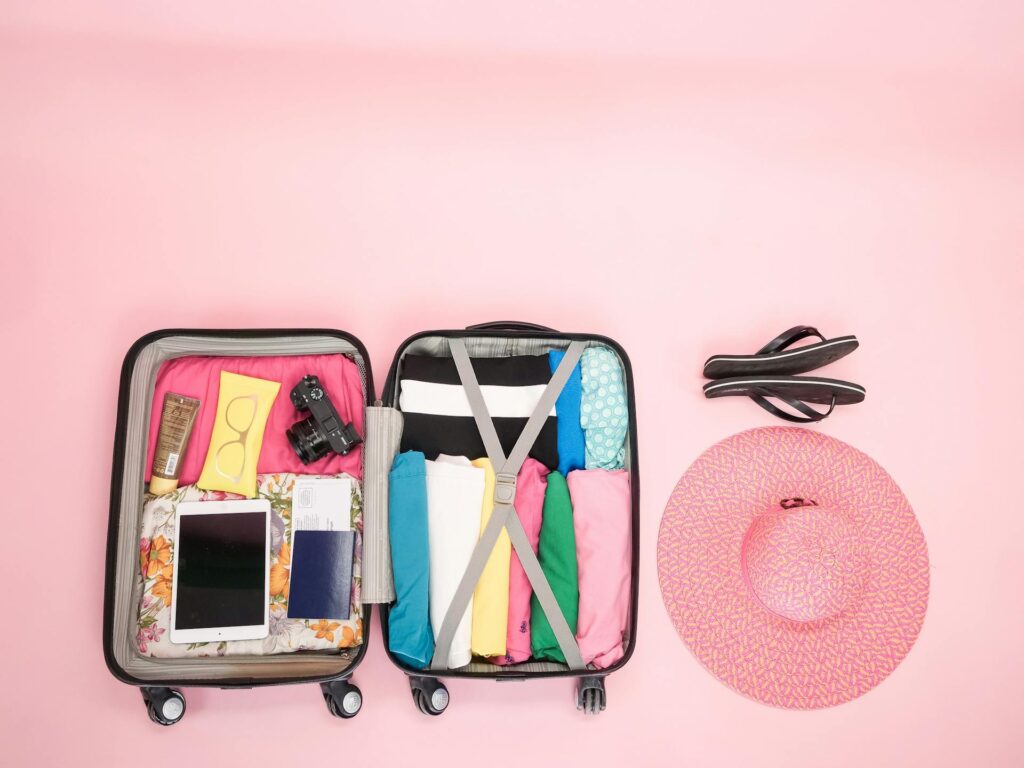 Luggage with a hat and flip flops