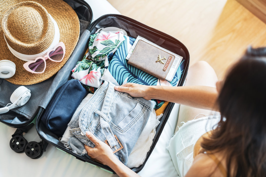 A person packing for Panama City Beach, FL